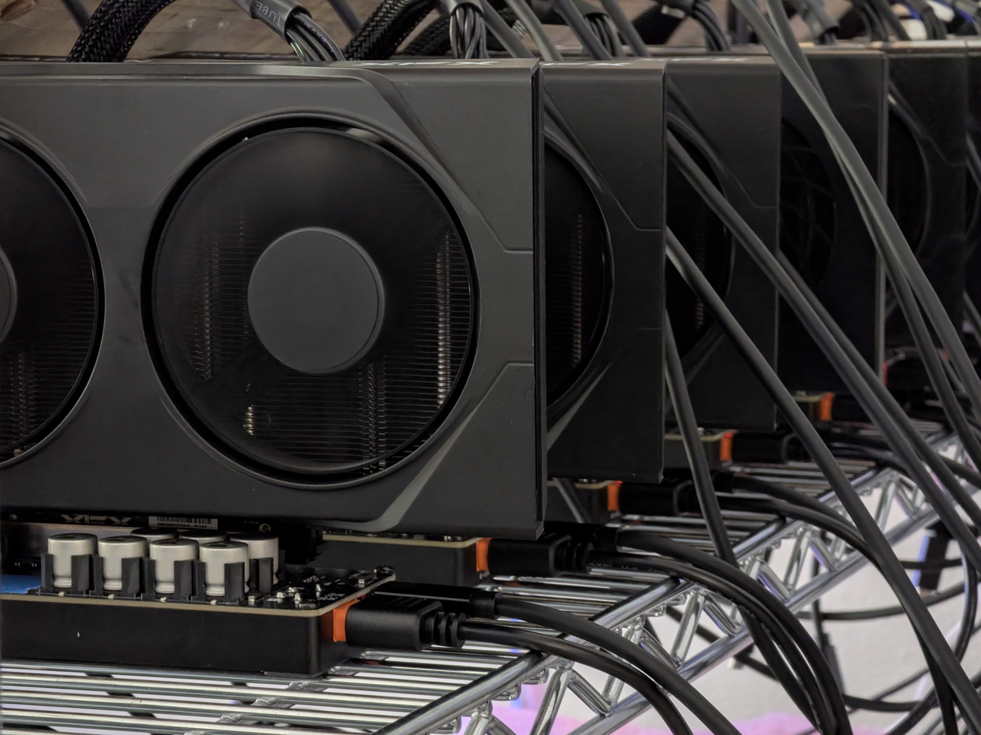 A row of GPUs on a shelf, each seated in a chestnut.