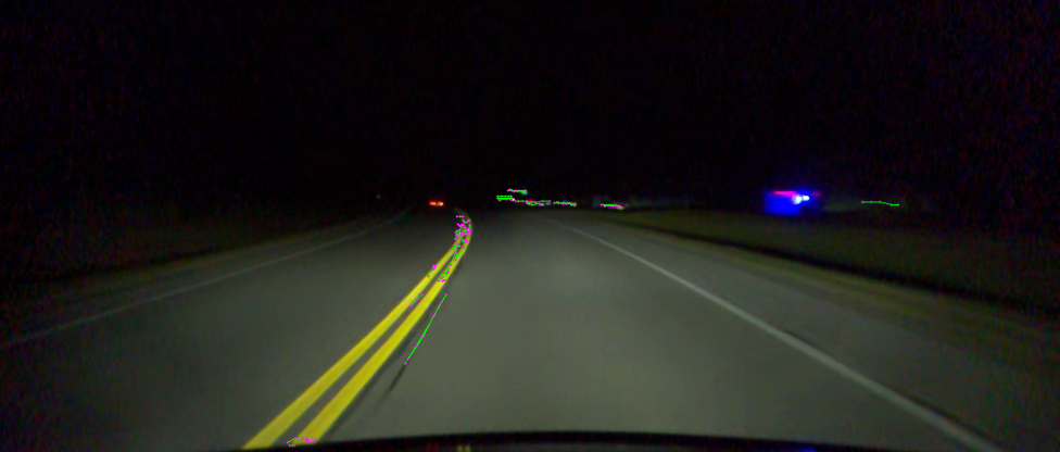 Night road scene showing tracked ORB points on a double-yellow line.